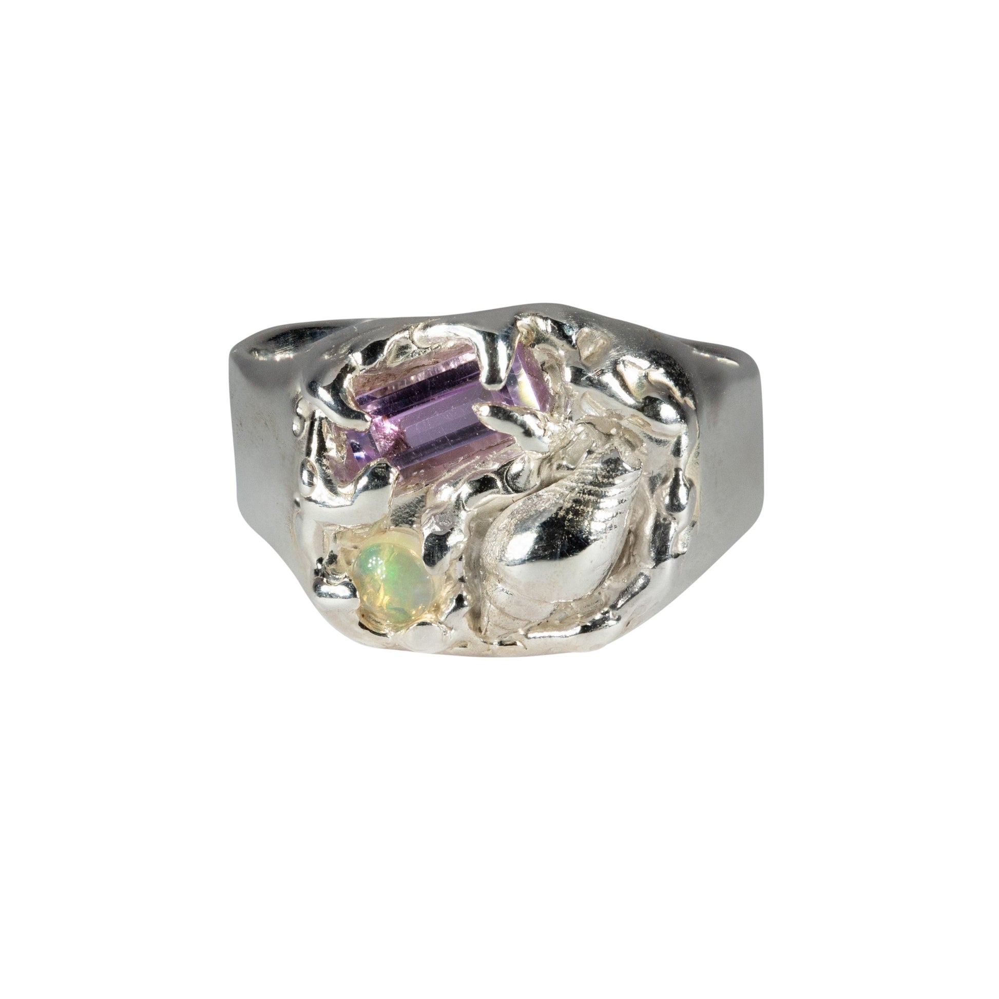 Silver ring with multicolored gemstones on a white background