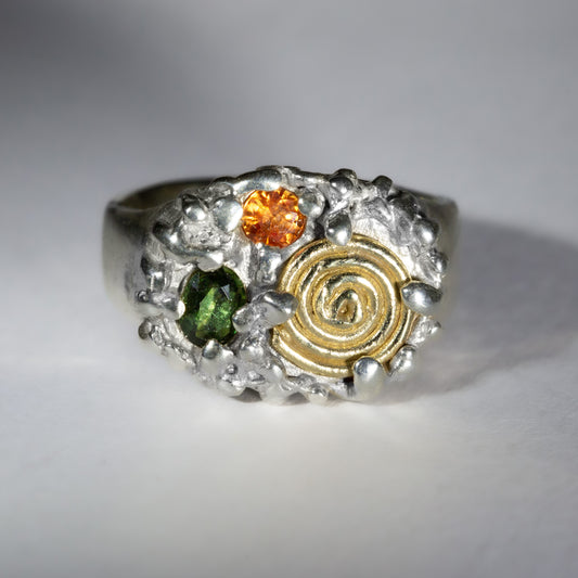 gold spiral finger rings. spiral finger ring.gold and silver alloy jewelry two tone silver and gold jewelry handmade jewellery shop london handmade gold jewellery london rainbow colored stone ring handmade jewellery united kingdom sapphire swirl.