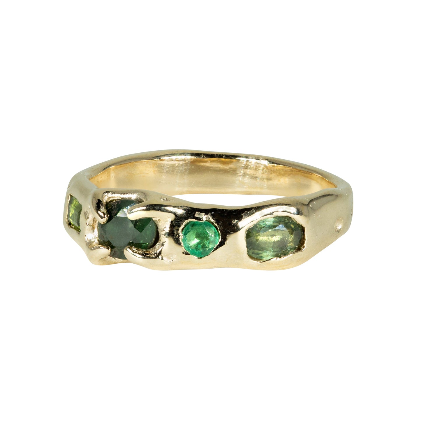 Gold ring with green gemstones on a white background